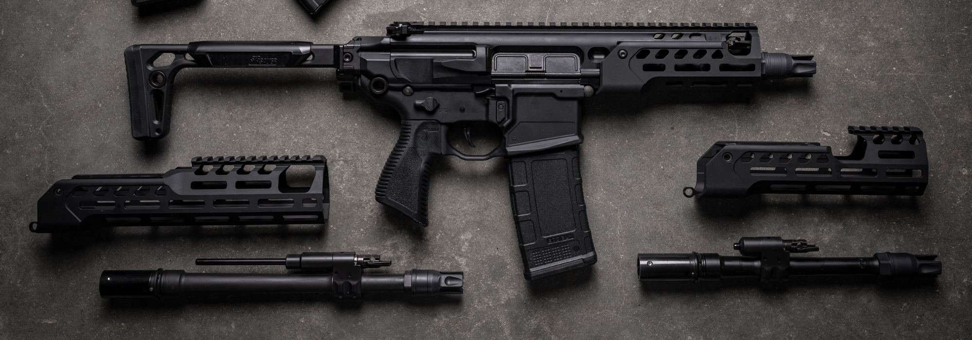 SIG Rattler LT compact pistol shown with interchangeable barrels and M-LOK handguards
